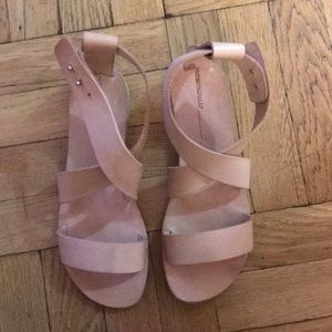 Intentionally____.” Leather sandal